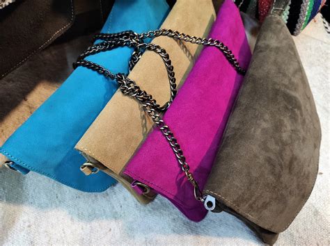 suede purses with zipper flap.